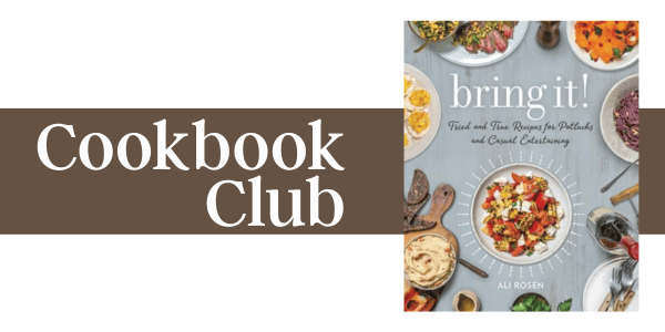 a cookbook titled “bring it!” by ali rosen sits on a table surrounded by dishes of food; the text “cookbook club” appears on a brown background beside it.