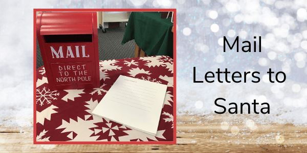 a red mailbox labeled "mail, direct to the north pole" sits on a table with snowflake patterns, next to a blank sheet of lined paper. text reads, "mail letters to santa.
